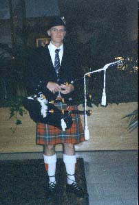 Bagpiper, Brian Quirk, of Lawrence, MA in MacAuley kilt.